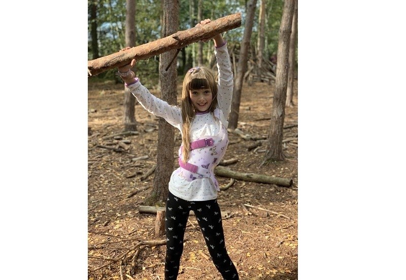 Beau wearing her scoliosis brace outdoors, enjoying an active lifestyle with confidence and support